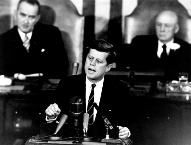 John F. Kennedy delivering his "Urgent National Needs" Speech to a joint session of Congress on May 25, 1961. Among other initiatives, but the one that is most remembered, he said, "I believe this nation should commit itself, before this decade is out, of landing a man on the Moon and returning him safely to Earth." 